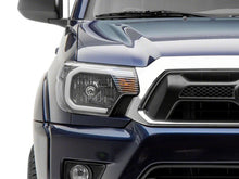 Load image into Gallery viewer, Raxiom 12-15 Toyota Tacoma Axial Series Headlights w/ LED Bar- Blk Housing (Clear Lens)