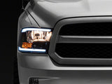 Raxiom 09-18 Dodge RAM 1500/2500/3500 Axial Series Headlights w/ LED Bar- Blk Housing (Clear Lens)