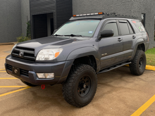 Load image into Gallery viewer, Cali Raised 03-09 Toyota 4Runner Trail Edition Bolt On Rock Sliders - No Kick Out / BedLiner