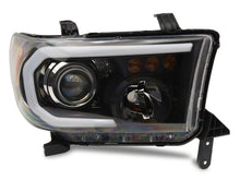 Load image into Gallery viewer, Raxiom 07-13 Toyota Tundra Axial Projector Headlights w/ SEQL LED Bar- Blk Housing (Clear Lens)