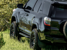 Load image into Gallery viewer, Cali Raised 10-24 Toyota 4Runner Step Ed Bolt On Rock Sliders - Kick Out/No Filler Plate/Raw Steel