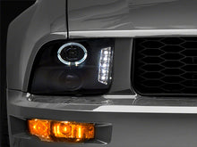 Load image into Gallery viewer, Raxiom 05-09 Ford Mustang Excluding GT500 LED Halo Projector Headlights- Blk Housing (Clear Lens)