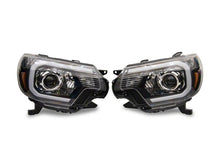 Load image into Gallery viewer, Raxiom 12-15 Toyota Tacoma Axial Series Projector Headlights w/ LED Bar- Blk Housing (Clear Lens)