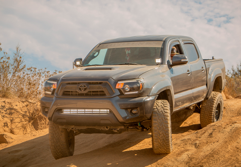 Cali Raised 05-15 Toyota Tacoma Low Profile Led Ditch Light Brackets Kit W/Amber Backlight - Tall