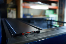 Load image into Gallery viewer, Roll-N-Lock 17-19 Ford F-250/F-350 Super Duty 80-3/8in E-Series Retractable Tonneau Cover