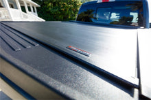 Load image into Gallery viewer, Roll-N-Lock 15-17 Ford F-150 65-5/8in E-Series Retractable Tonneau Cover