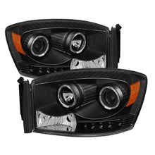 Load image into Gallery viewer, xTune Dodge Ram 1500 06-08 / Ram 2500/3500 06-09 Halo Projector Headlights Black PRO-JH-DR06-LED-BK