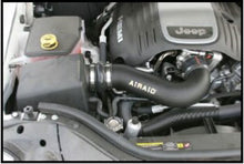 Load image into Gallery viewer, Airaid 05-10 Jeep Grand Cherokee 5.7L Hemi Airaid Jr Intake Kit - Dry / Red Media